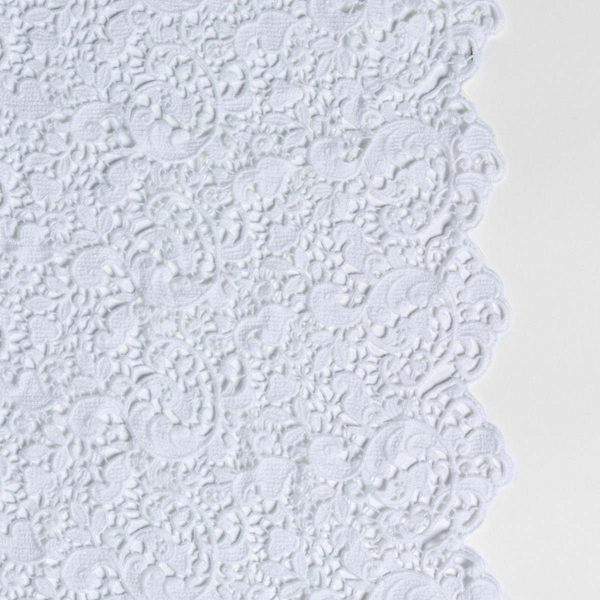 Close-up of White Bella Notte Allora bed scarf showing floral lace texture and scalloped edge.