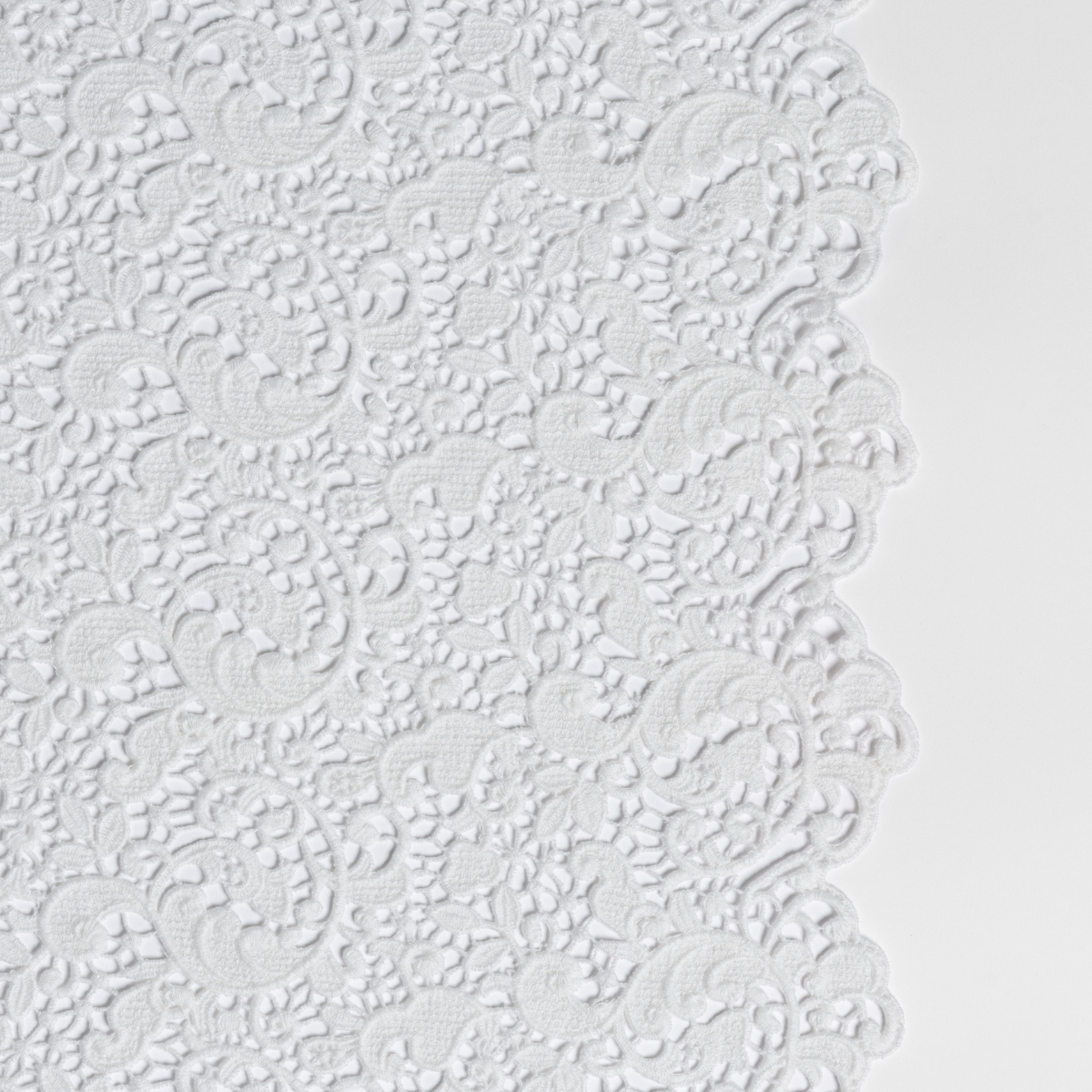 Close-up of Bella Notte Allora bed scarf in Winter White showing intricate floral lace-like edge detail.