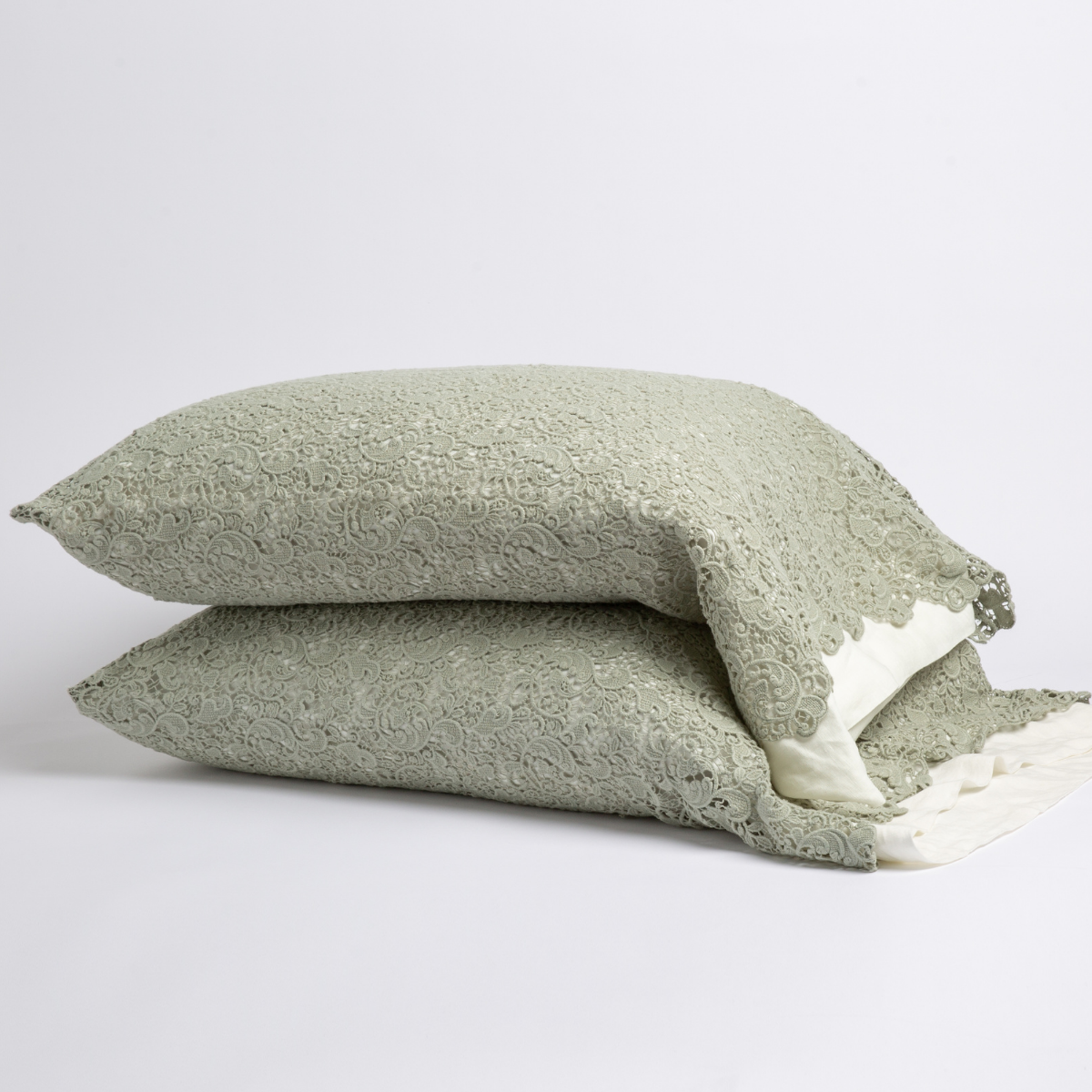 Two stacked Eucalyptus lace pillowcases showing intricate floral lace trim detail against white background.