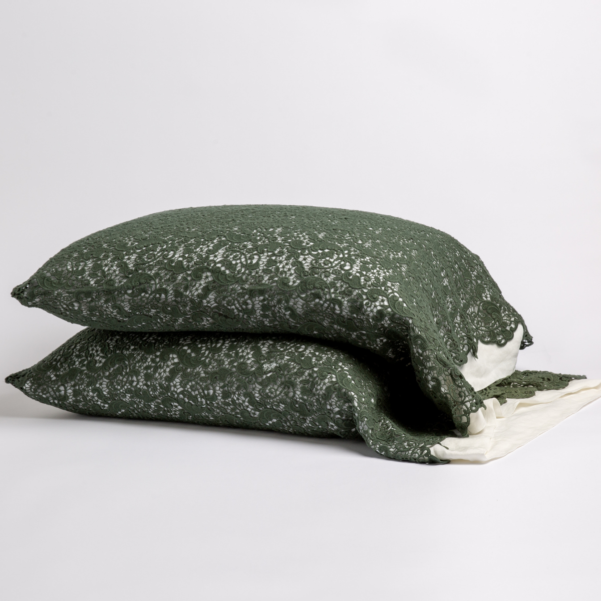 Two stacked Juniper Allora Lace pillowcases with ivory lace trim detail against a white background.