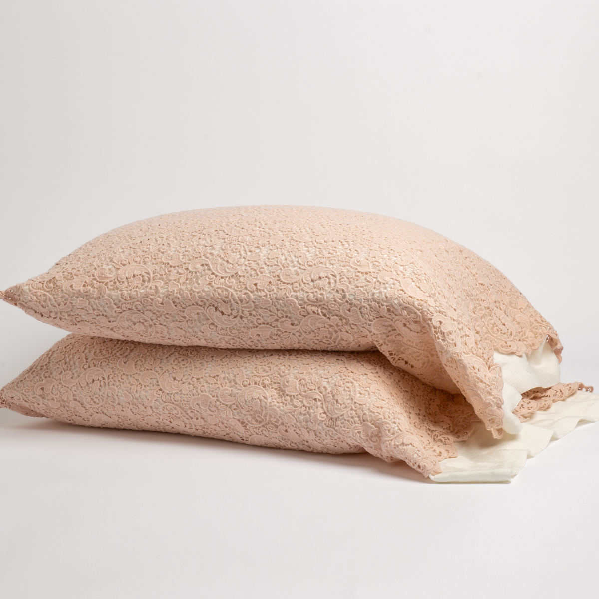 Two Pearl Bella Notte Allora Lace pillowcases stacked, showing delicate lace texture with ivory ruffle trim.