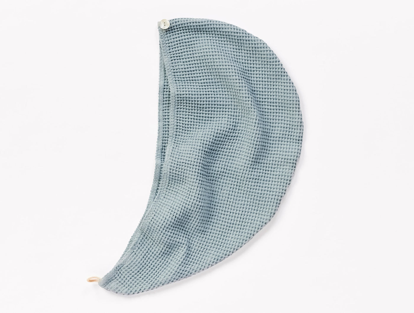 Coyuchi Waffle Hair Wrap in slate blue, shown draped open to reveal waffle-weave texture.