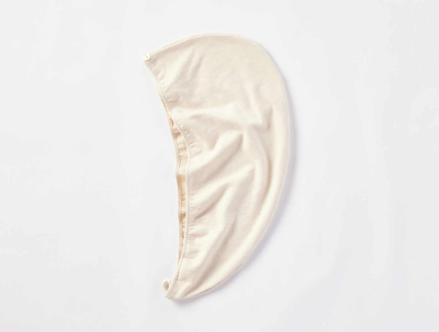 Coyuchi Bare Hair Wrap in natural ivory, displayed flat on white background.