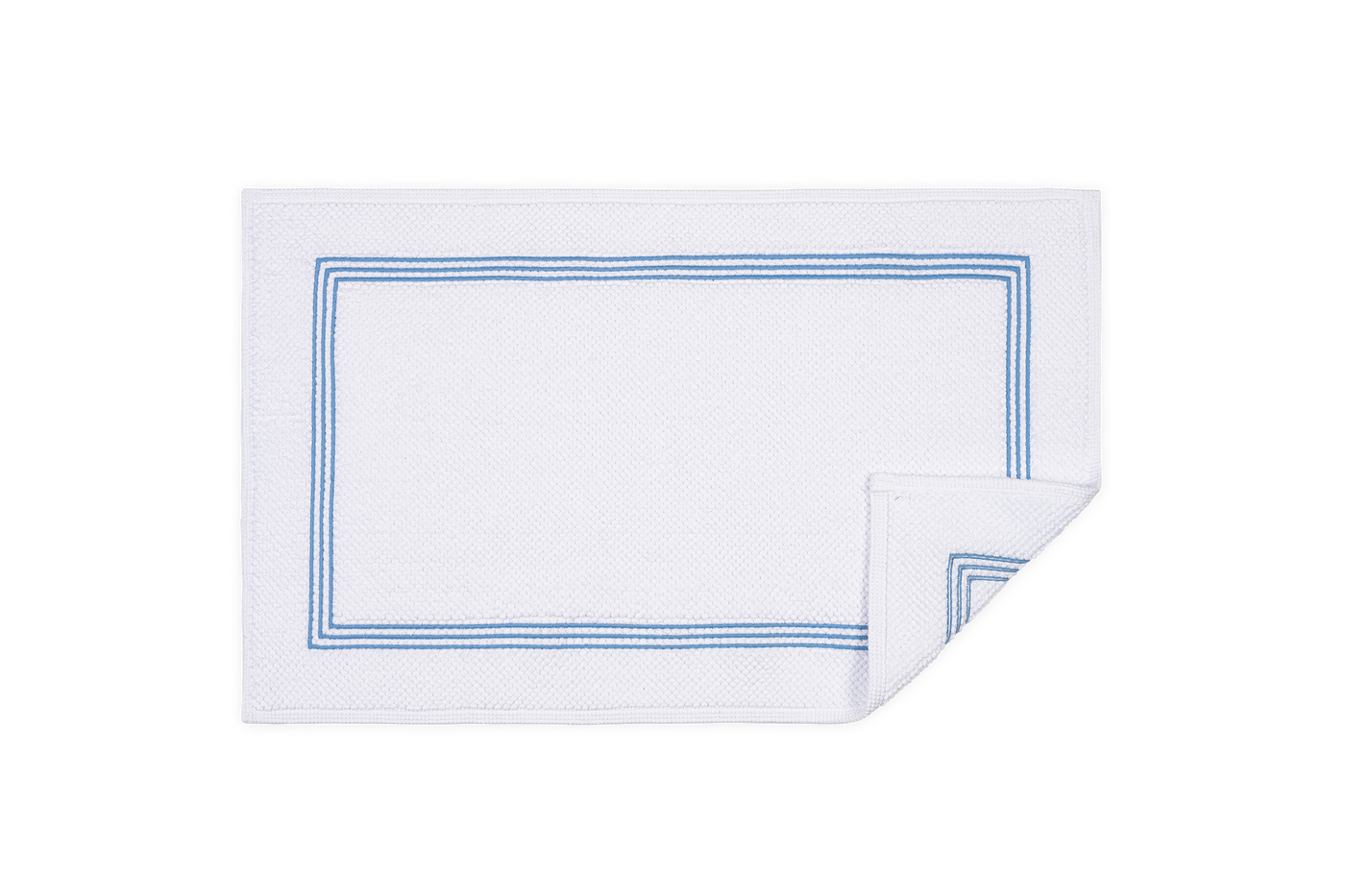 Matouk Bel Tempo white bath rug with blue double-stripe border detail.