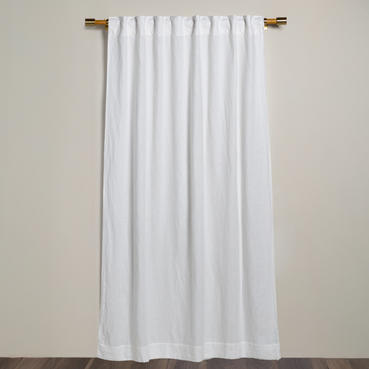 Bella Notte linen curtain panel in Winter White, full-length view on brass rod.