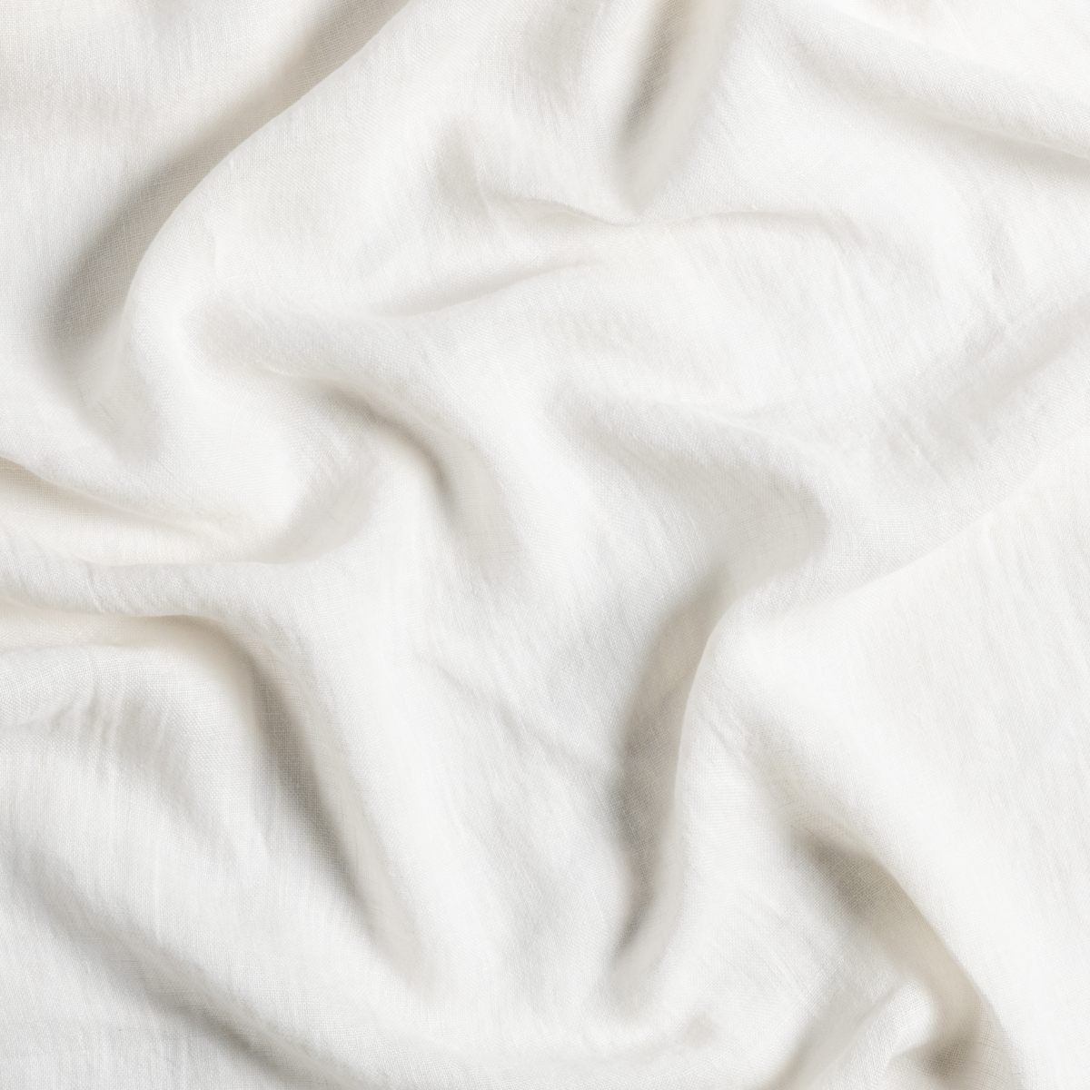 Close-up of Bella Notte Linen Whisper guest towel in Natural, showing soft draped linen texture.