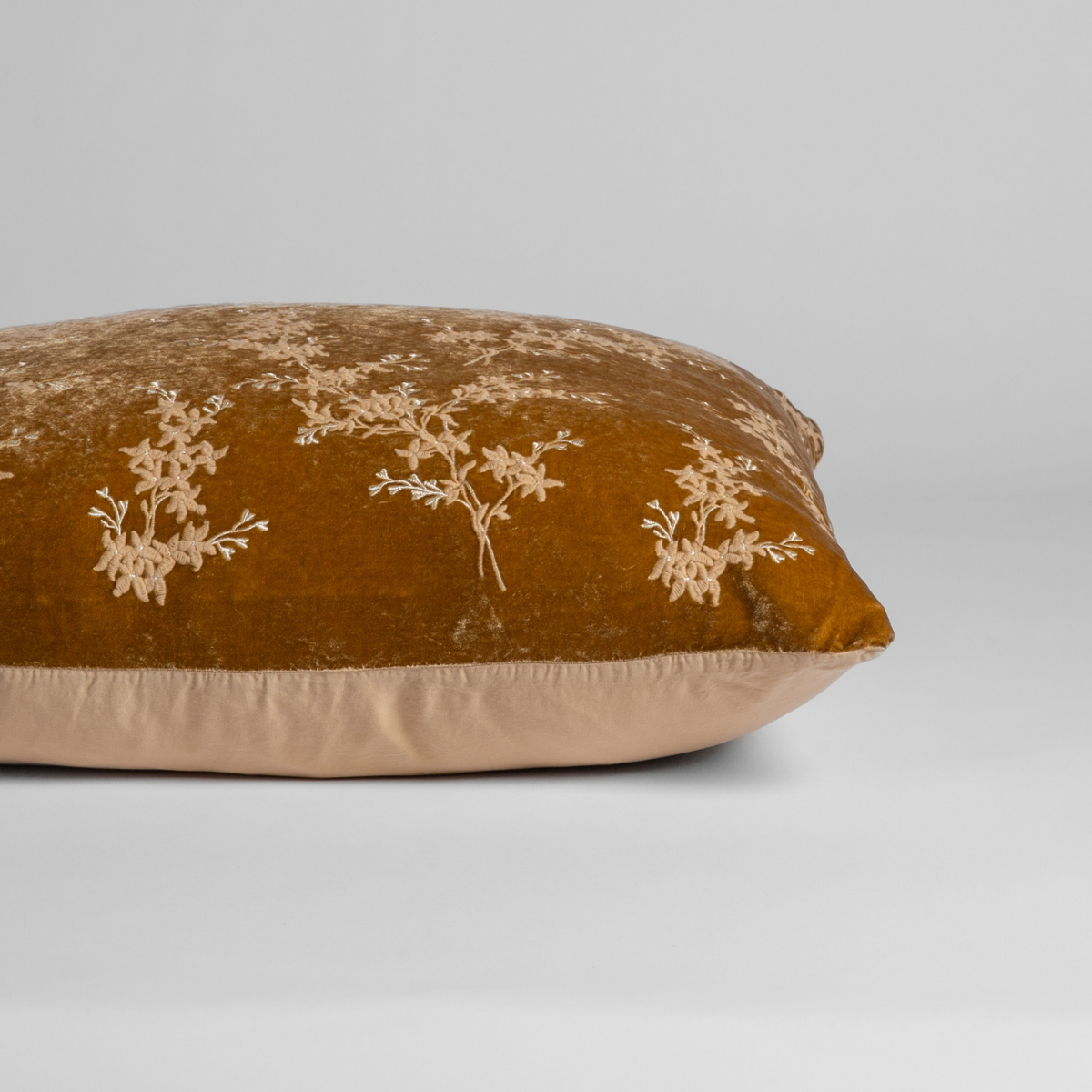Side view of Bella Notte Lynette Luxe sham in Honeycomb velvet with cream floral embroidery.