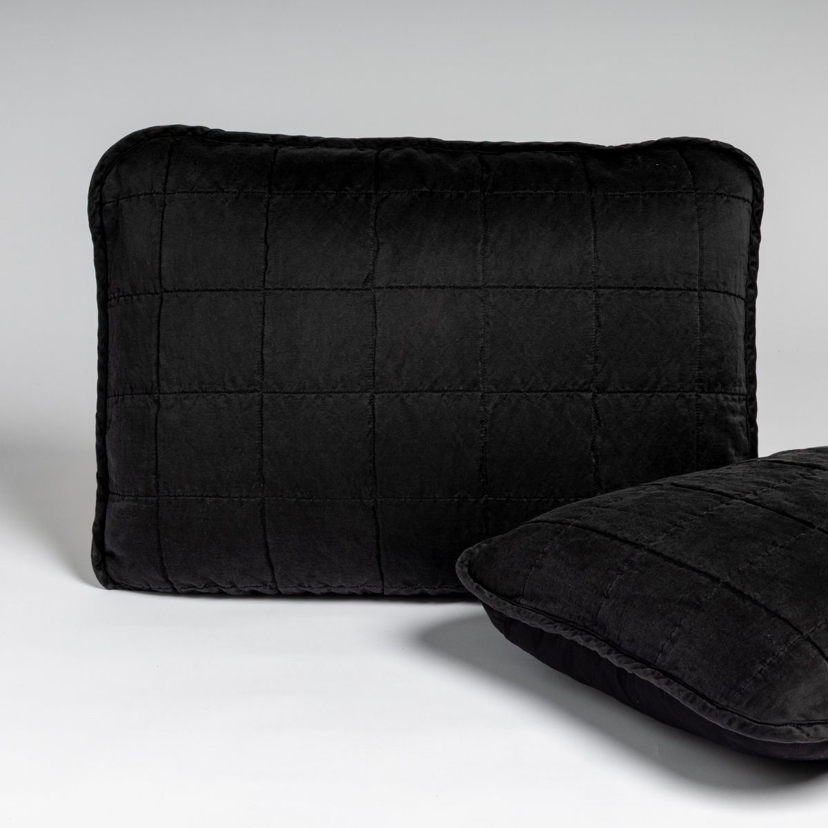 Corvino velvet sham with grid quilting, shown front and angled views.