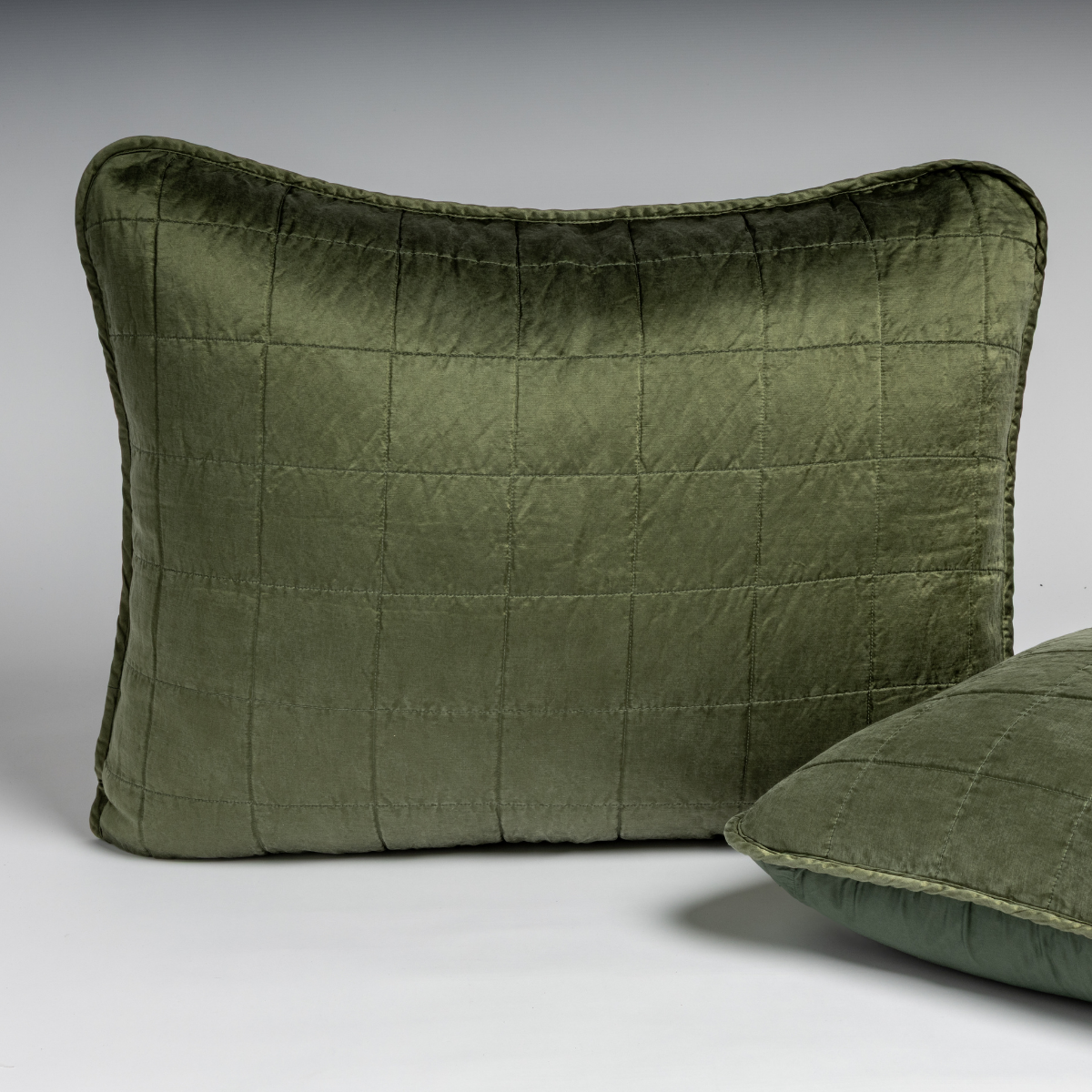 Juniper velvet quilted sham with grid stitching, second sham partially visible in foreground.