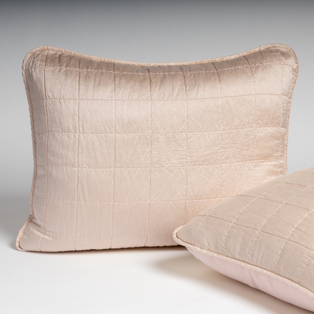 Bella Notte Sel sham in Pearl, quilted grid stitching on lustrous fabric, two shams stacked.
