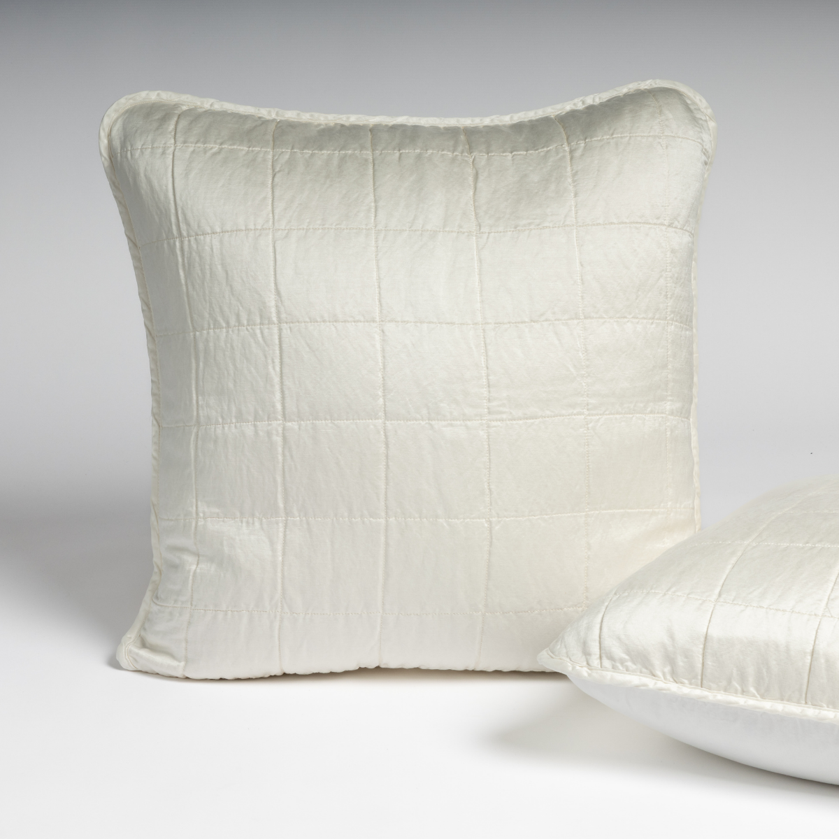 Bella Notte Sel sham in Winter White, reverse angle showing quilted grid stitching detail.