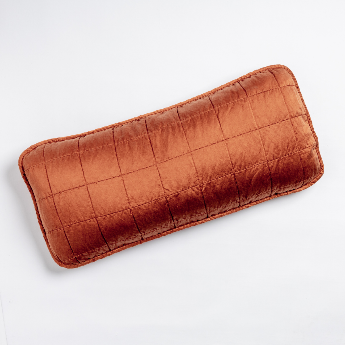 Bella Notte Sel throw pillow in Autumn, quilted grid stitching on velvet, bolster shape.