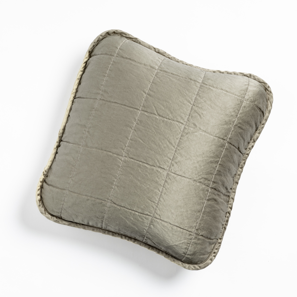 Overhead view of Fog quilted Sel throw pillow with textured border trim.
