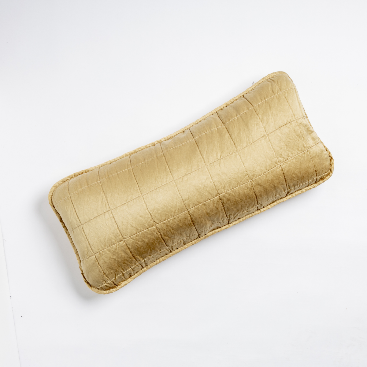Honeycomb quilted lumbar throw pillow with grid stitching and scalloped trim detail.