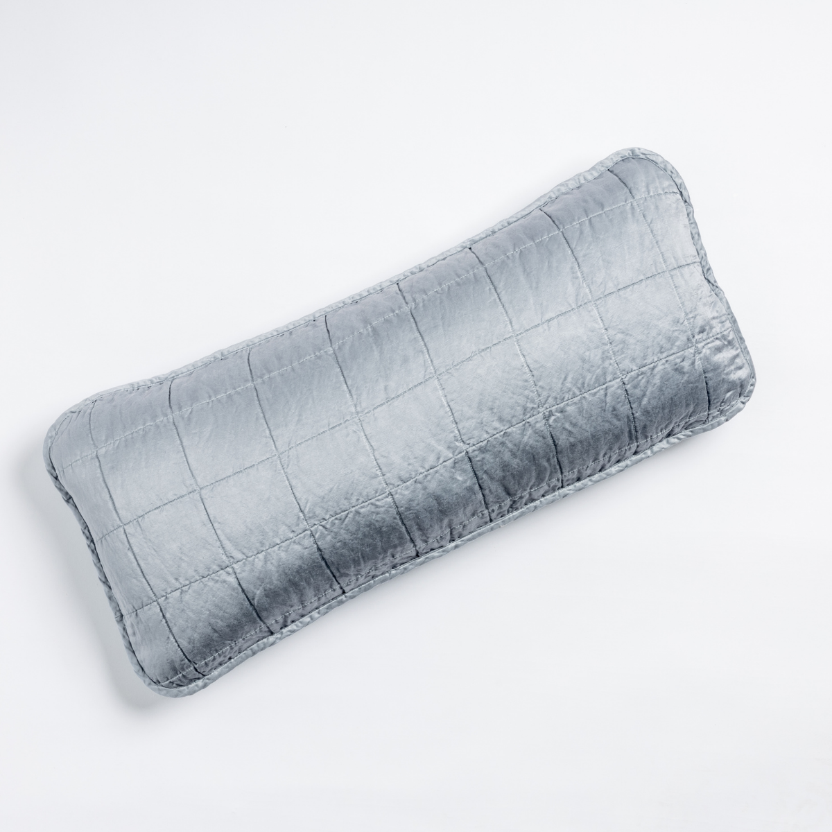 Bella Notte Sel throw pillow in Tahoe Blue, showing quilted grid stitching on lustrous velvet.