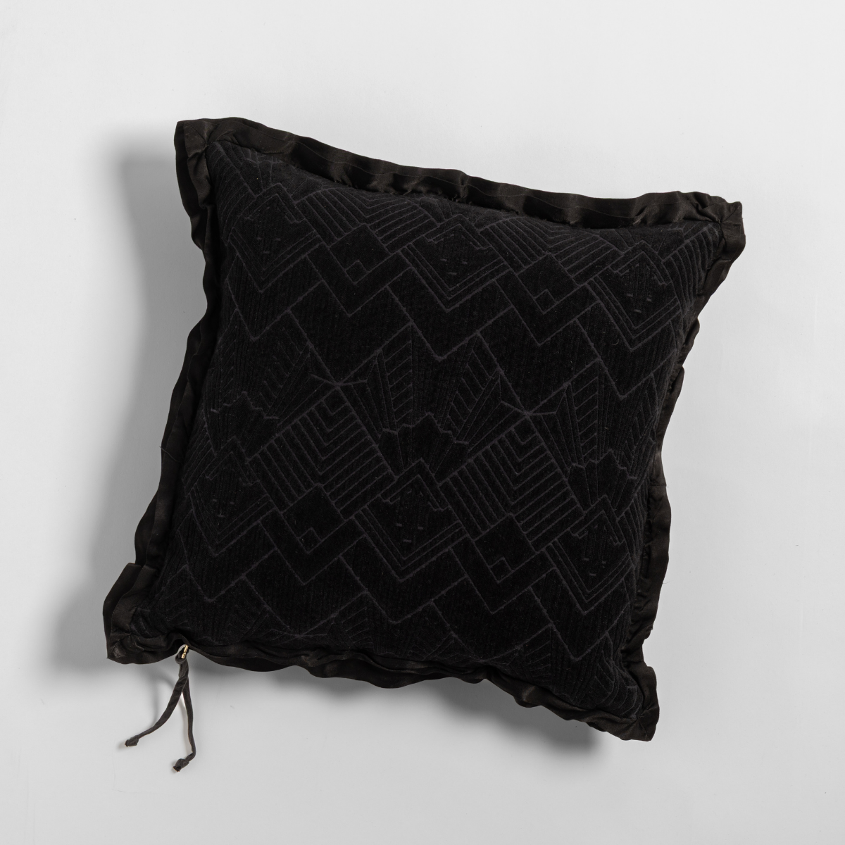 Bella Notte Trettino throw pillow in Corvino, velvet geometric pattern with satin ruffle trim.