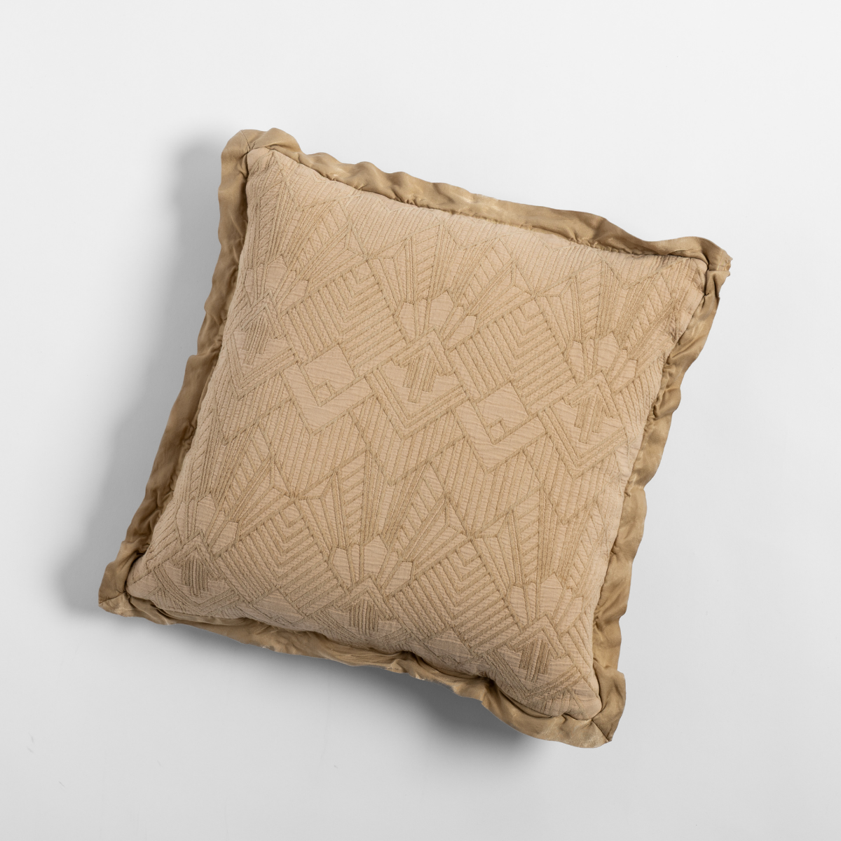 Close-up of Bella Notte Trettino throw pillow in Honeycomb with geometric jacquard and ruffled trim.