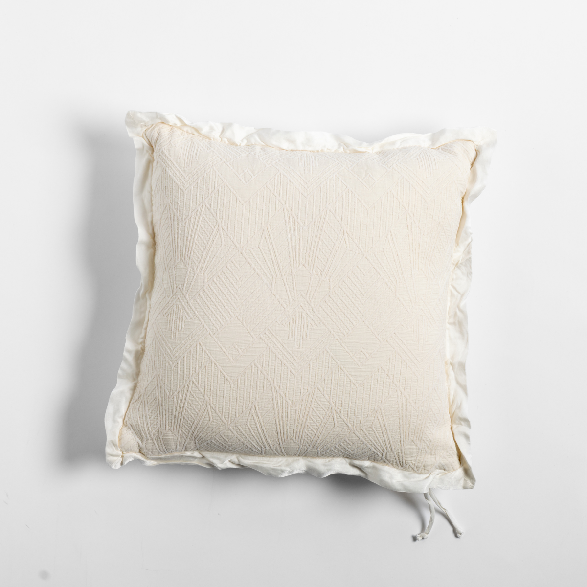 Bella Notte Trettino throw pillow in Natural with textured quilting and ruffled flange edge.