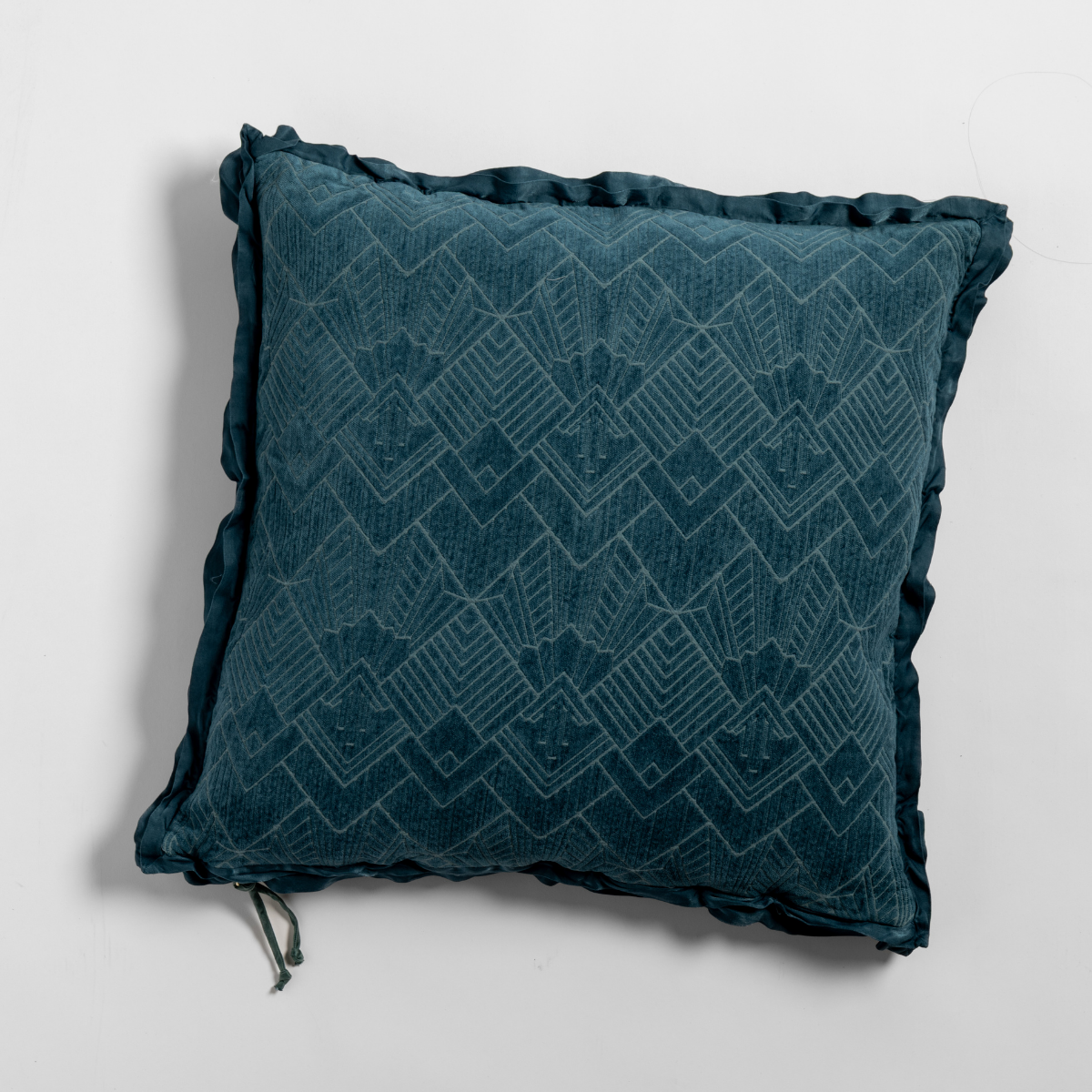 Bella Notte Trettino throw pillow in Cenote, geometric jacquard pattern with ruffle trim detail.
