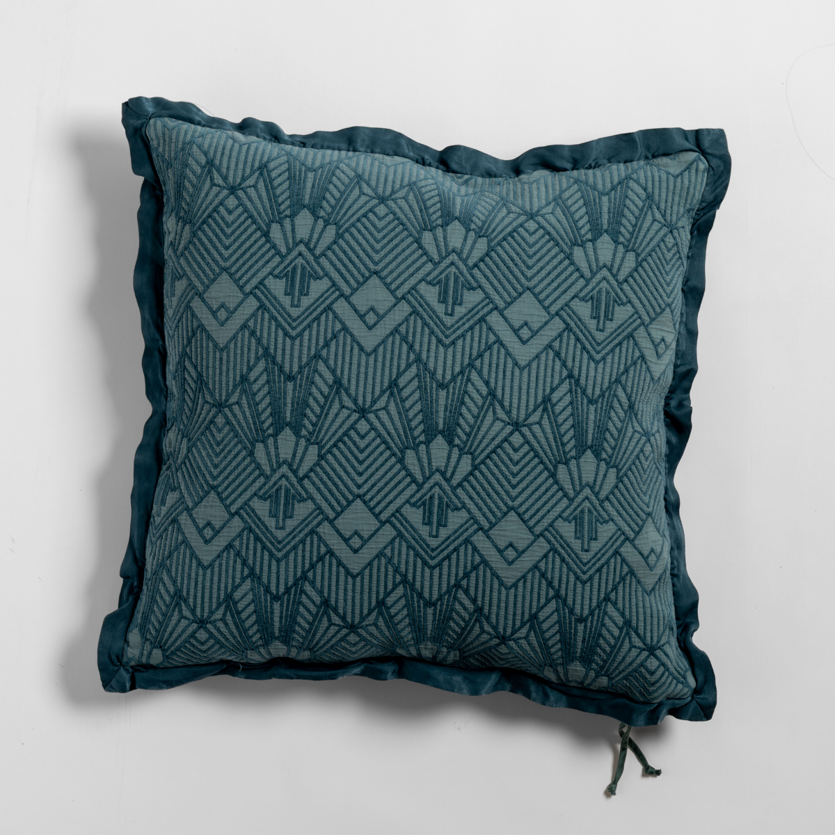 Bella Notte Trettino throw pillow in Cenote, Art Deco diamond jacquard with ruffled trim.