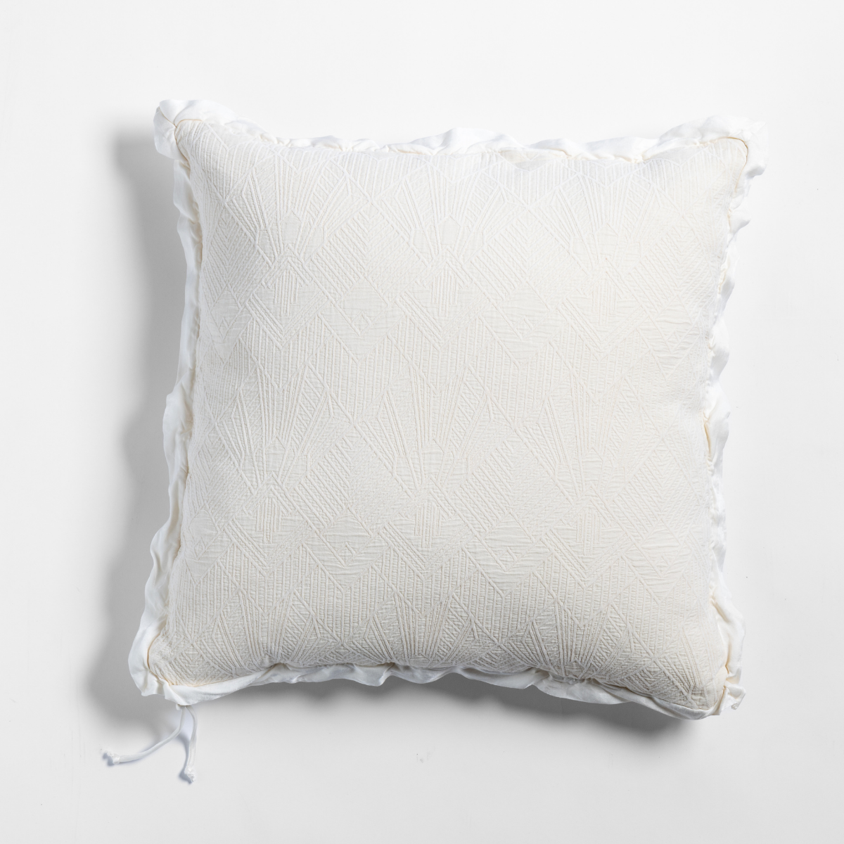Bella Notte Trettino throw pillow in Natural with ruffled edge trim and textured weave.