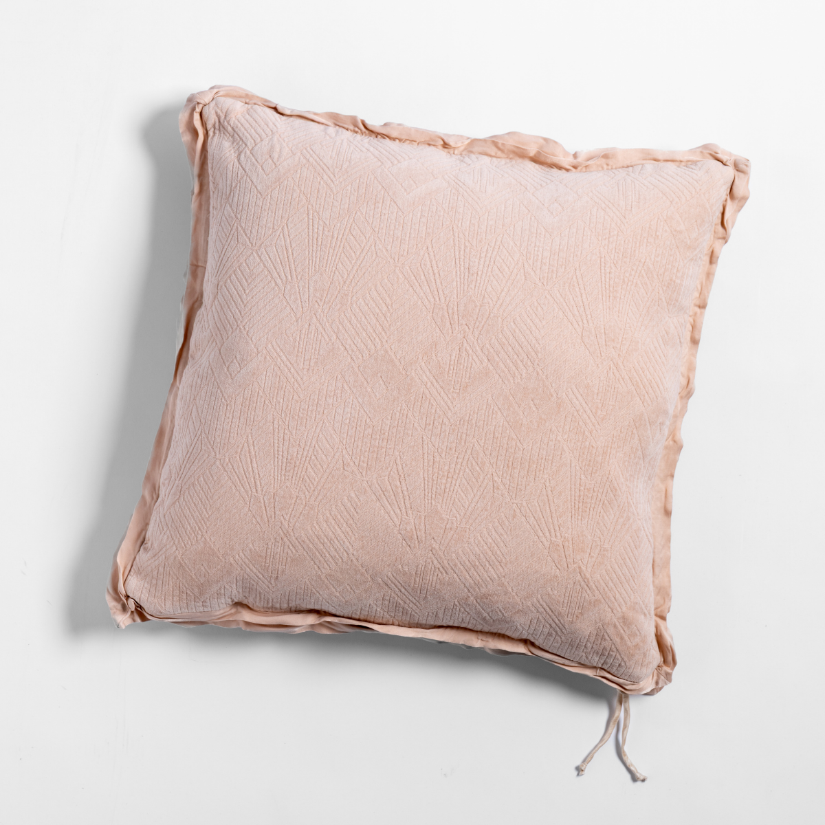 Bella Notte Trettino throw pillow in Pearl with textured matelassé surface and frayed ruffle trim.