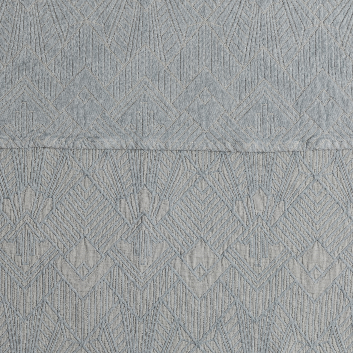 Close-up of Bella Notte Trettino sham in Cloud, showing diamond jacquard weave detail.