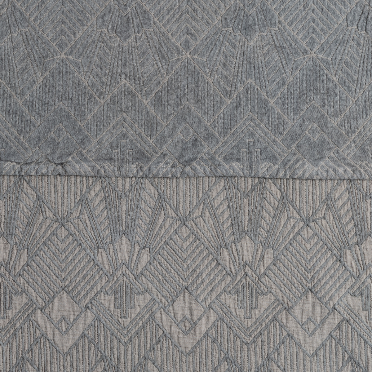 Close-up of Bella Notte Trettino sham in Fog, showing geometric diamond jacquard weave detail at hem.