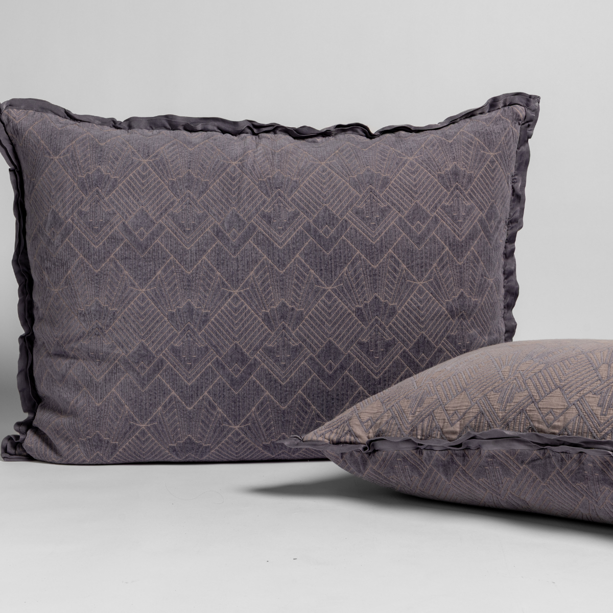 Bella Notte Trettino sham in French Lavender, two pillows showing front and side angle.