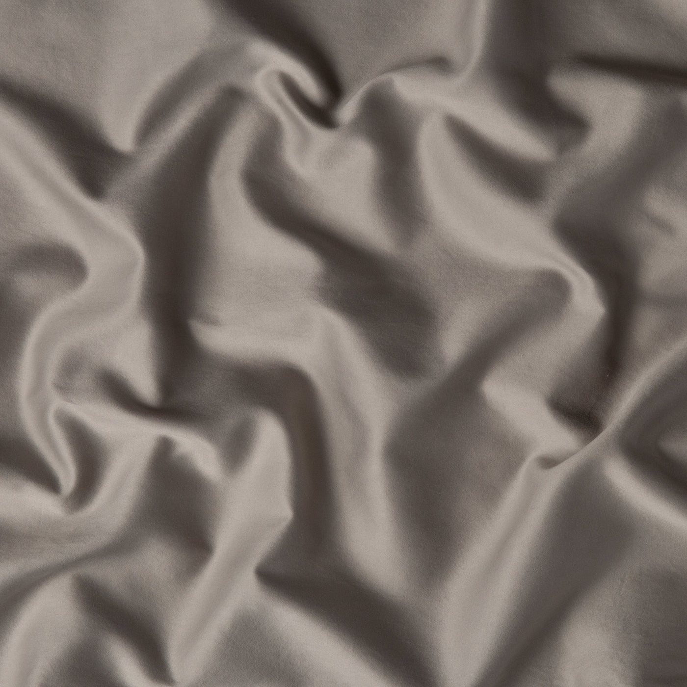Close-up of Fog Bria duvet cover fabric showing smooth sateen drape and soft sheen.