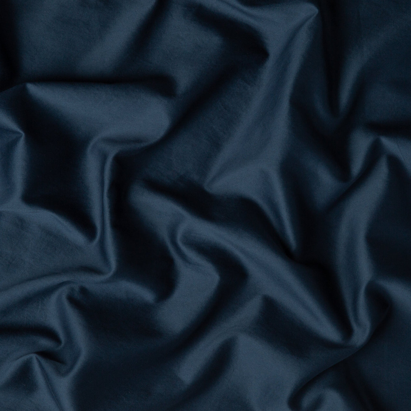 Midnight Bria duvet cover fabric close-up showing smooth cotton drape and sheen.