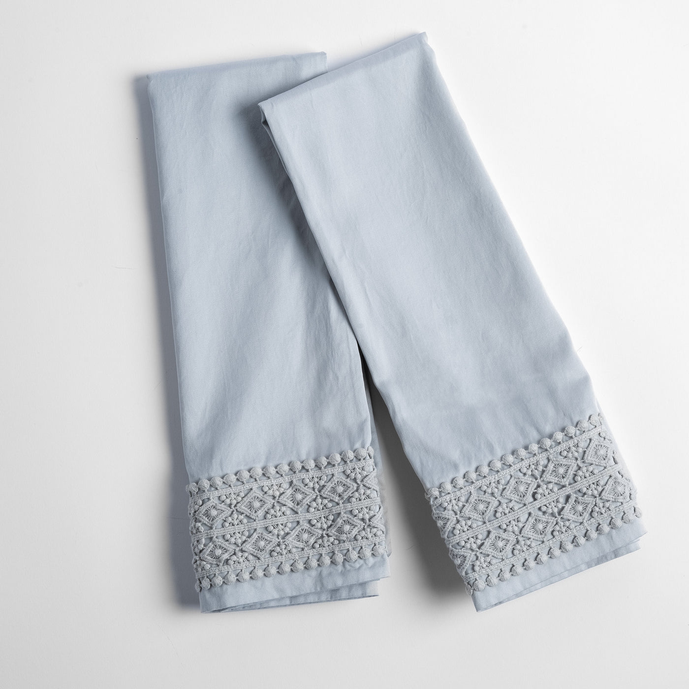 Bria pillowcase pair in Cloud with geometric lace trim detail at hem.