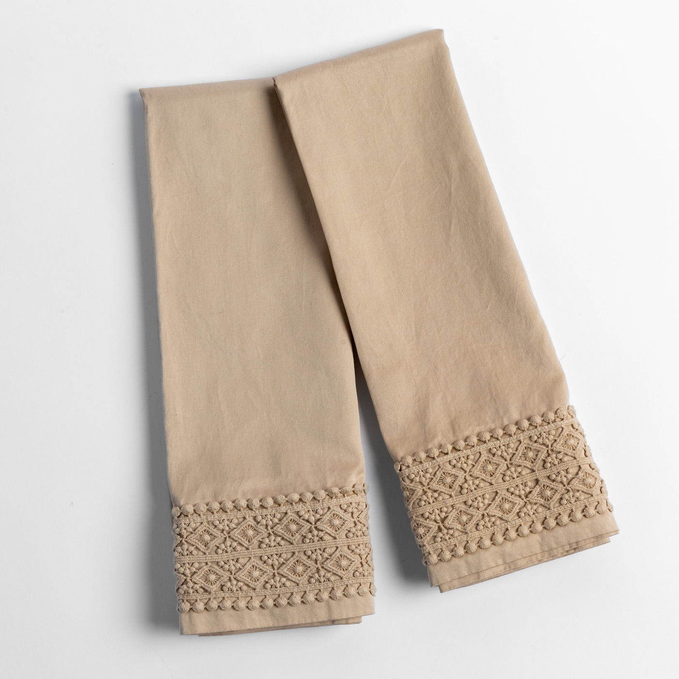 Close-up of Honeycomb pillowcase hem with diamond lace trim and bobbin edge detail.