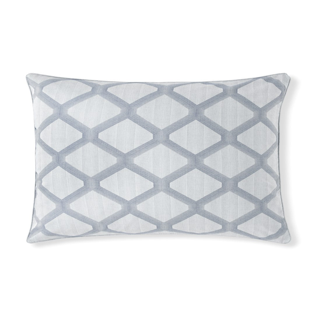 Close-up of Cidade sham in mist blue diamond lattice embroidery on white cotton.