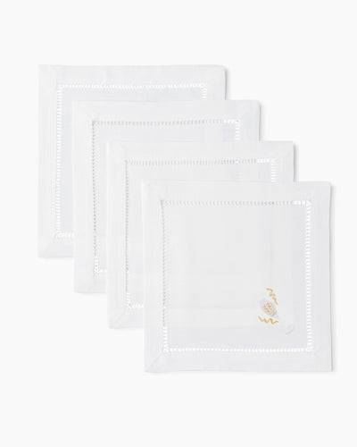 Henry Handwork white linen cocktail napkins with hemstitch border and gold champagne embroidery, set of 4.