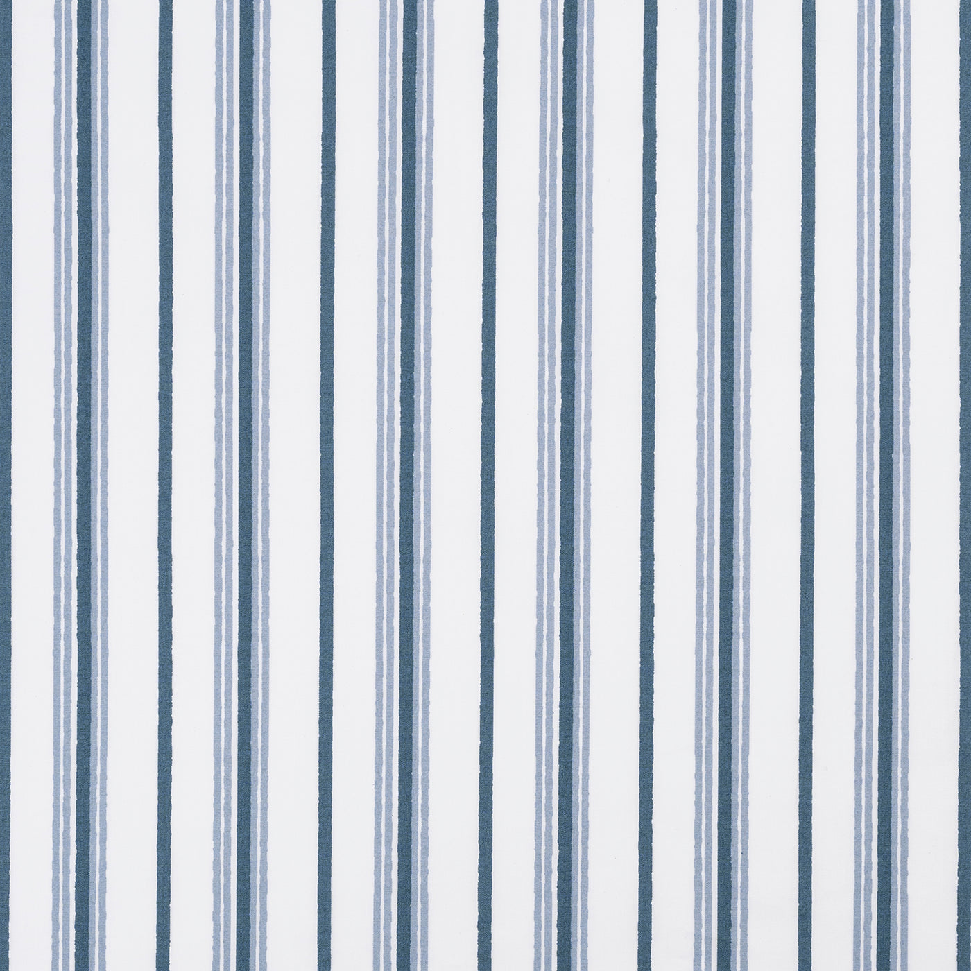 Close-up of Matouk Calypso fabric showing navy and slate blue stripes on white cotton.