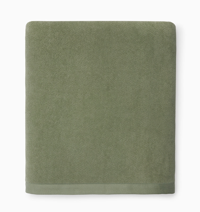 Close-up of Sferra Canedo Nuovo bath towel in sage with woven texture border detail.