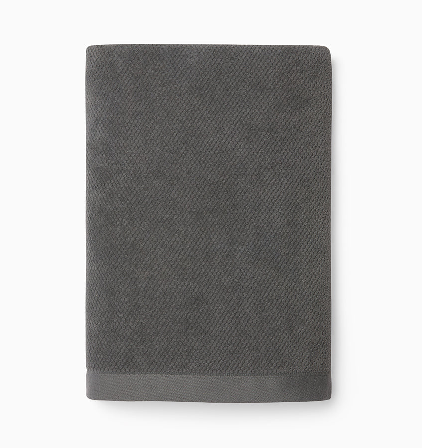 Sferra Canedo Nuovo hand towel in graphite cotton terry, folded flat, dobby border detail.