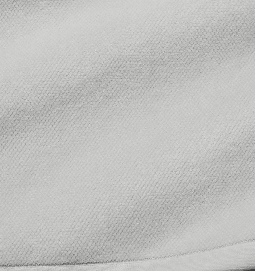 Close-up of Sferra Canedo Nuovo tub mat in silver, showing textured cotton weave.