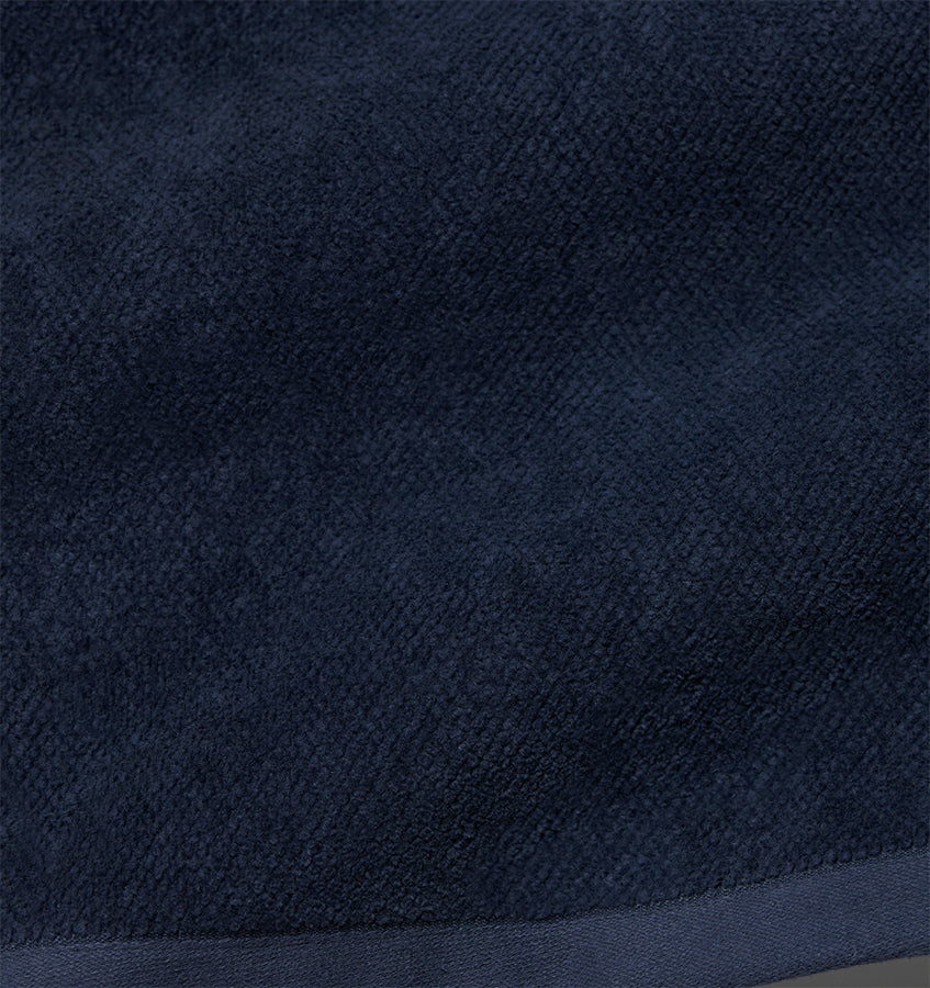 Close-up of navy terry weave texture on Sferra Canedo Nuovo tub mat.