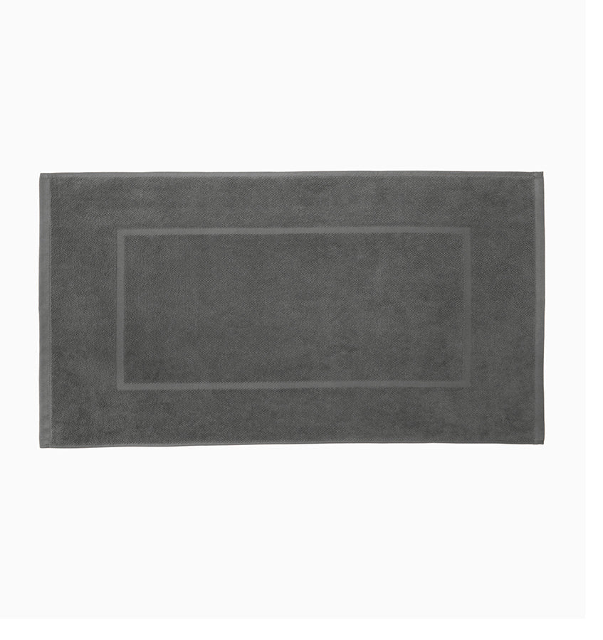 Sferra Canedo Nuovo graphite cotton tub mat with woven border detail.
