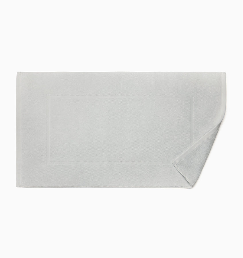 Corner fold detail on a silver Sferra Canedo Nuovo tub mat.