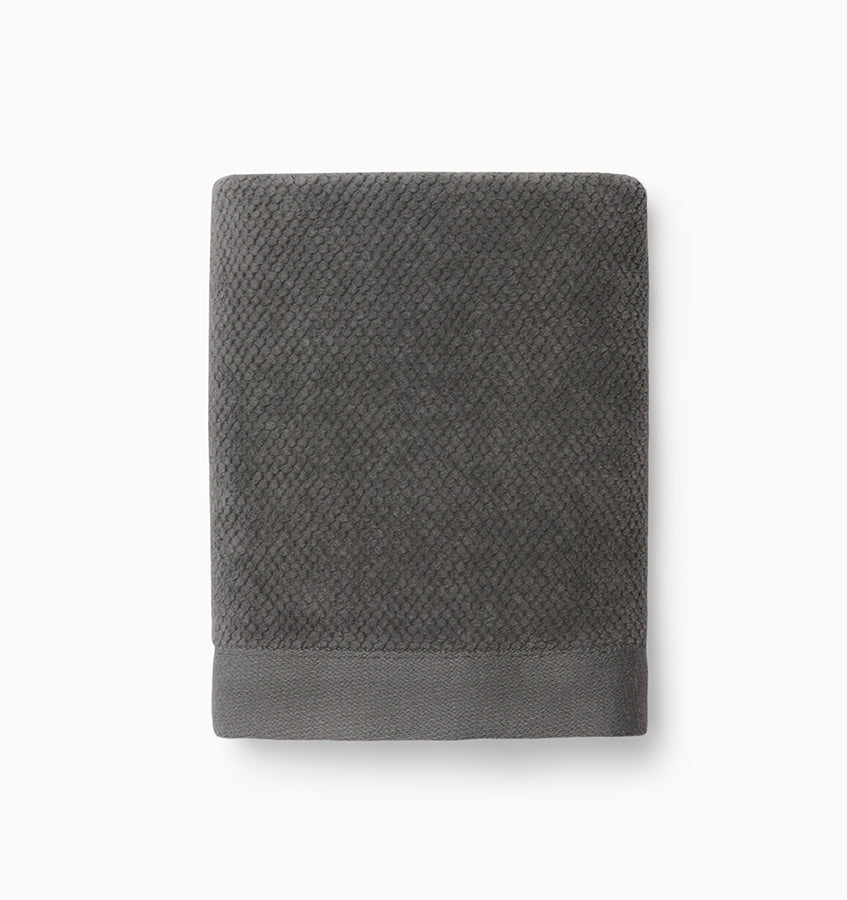 Sferra Canedo Nuovo washcloth in charcoal with textured cotton weave and woven border.