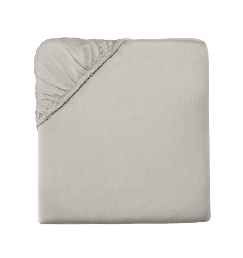 Sferra Carlotta fitted sheet in silver folded flat, elastic corner visible.