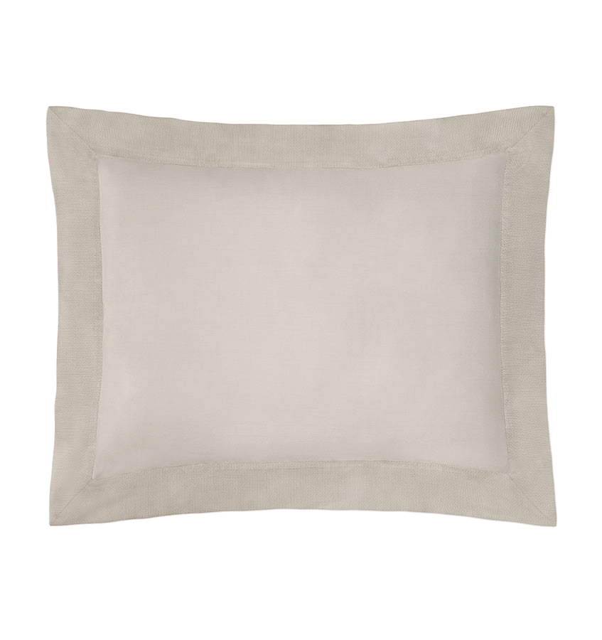 Sferra Carlotta sham in champagne linen with a tailored border flange, flat lay.