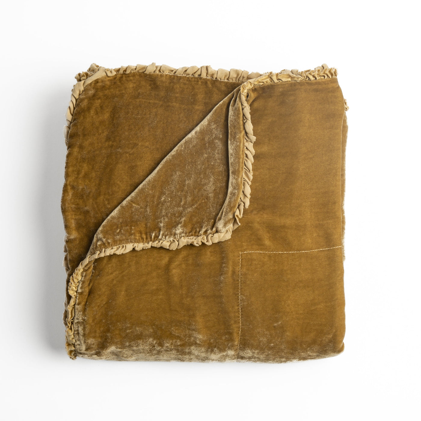 Folded Bella Notte Carmen blanket in Honeycomb, showing velvet face and fringe trim detail.