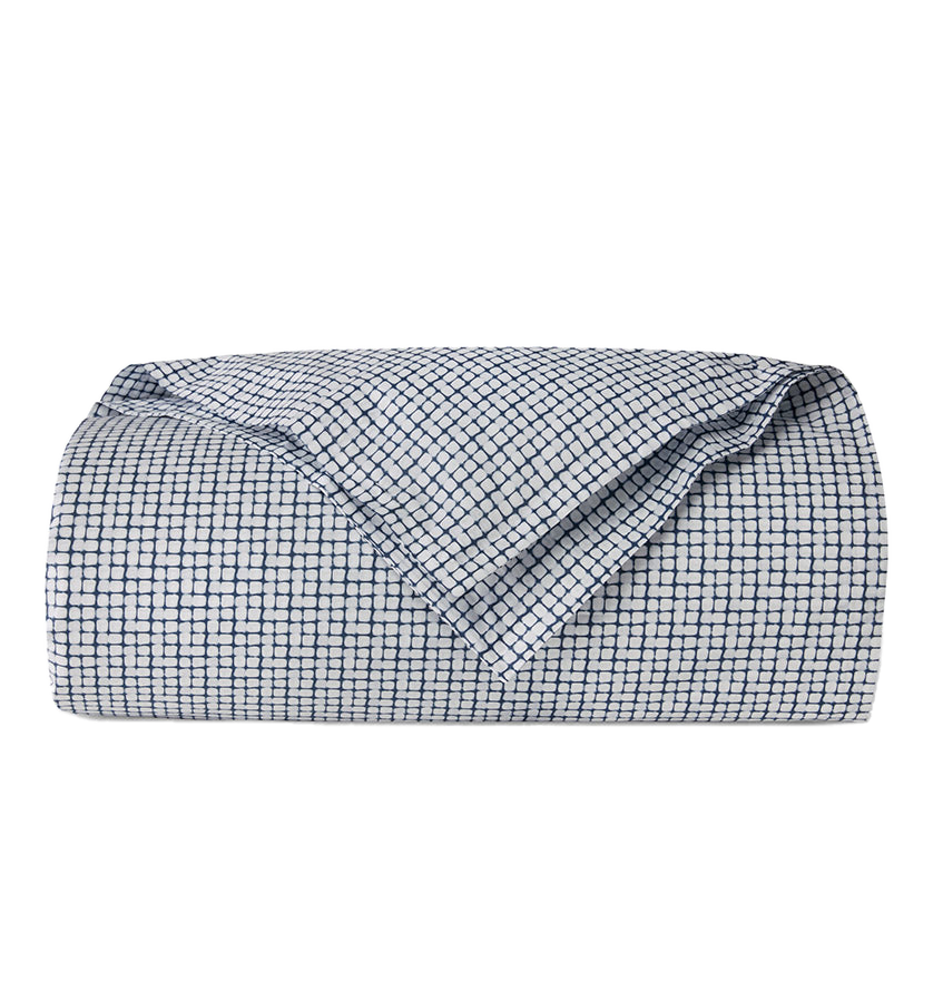 Sferra Caselle duvet cover, folded, white cotton with navy geometric grid print.