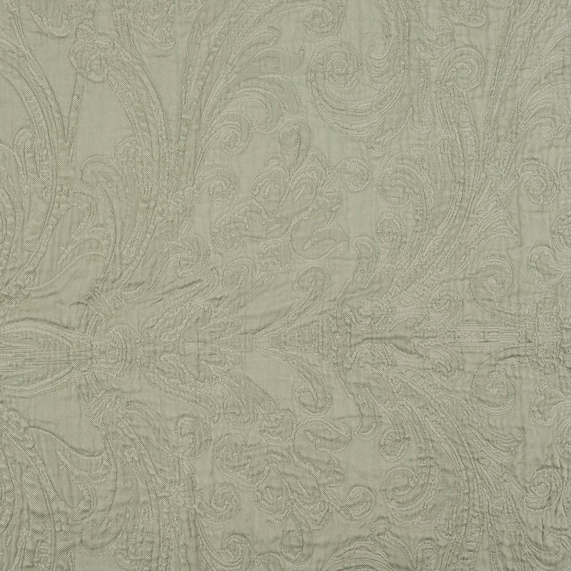 Close-up of pale green fabric with intricate damask pattern featuring a Pillow Cover by Celso de Lemos available at Linen Society.