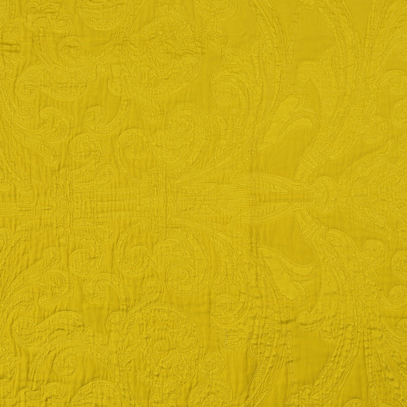 Textured yellow fabric with an ornate damask pattern, featuring the Braga Pillow Cover by Celso de Lemos available at Linen Society.