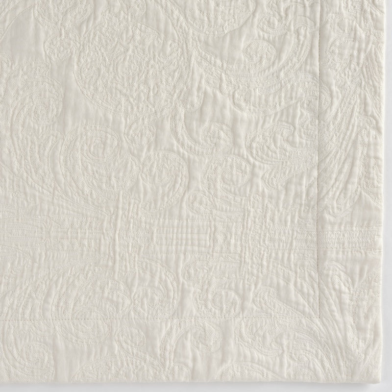 Close-up of a white textured Pillow Cover with a raised paisley pattern, featuring Braga Pillow Cover by Celso de Lemos available at Linen Society.